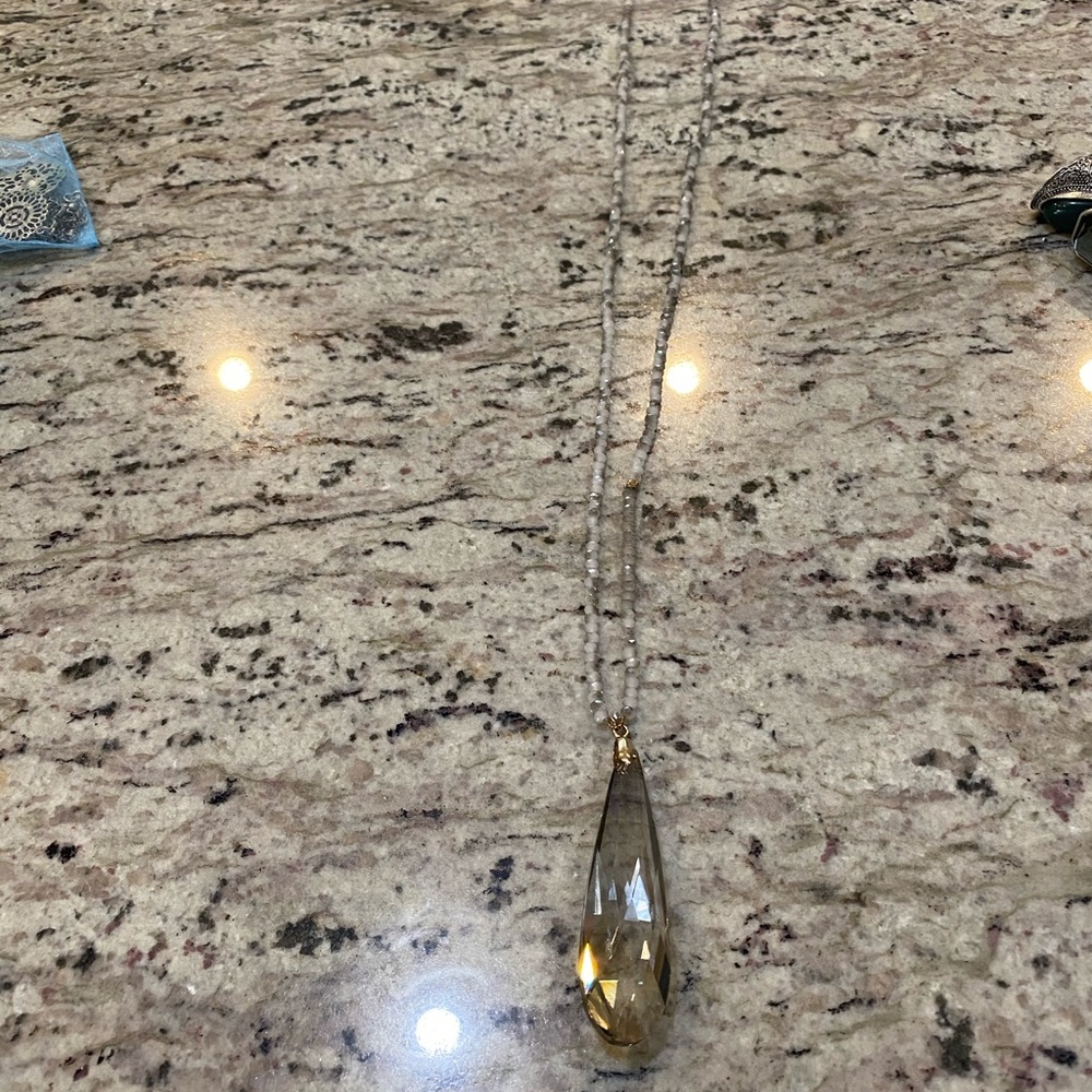 Long beaded pendant necklace